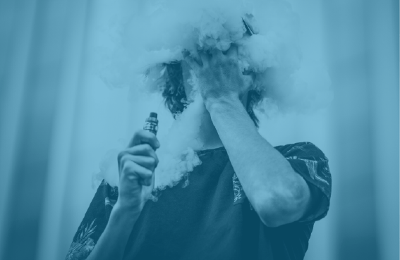 teenager hiding in a big cloud of vape